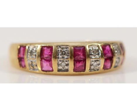 A 9ct gold diamond and ruby two row dress ring, M, 1.8g