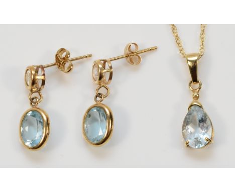 A pair of 9ct gold blue topaz drop earrings with scroll backs, 18mm, with a 9ct gold aquamarine pendant on a chain, 2.6g