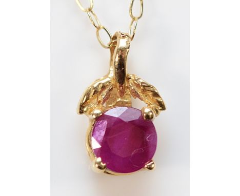A 14K gold ruby pendant on a 9ct gold chain, 4mm ruby, 1g