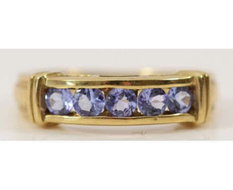 A 9ct gold tanzanite five stone ring, J, 2.7g