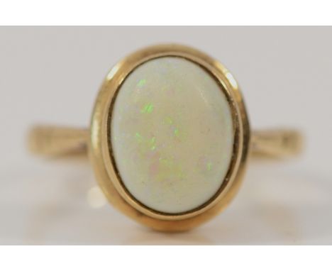 A 9ct gold opal dress ring, 10mm x 7mm opal, 2.9g
