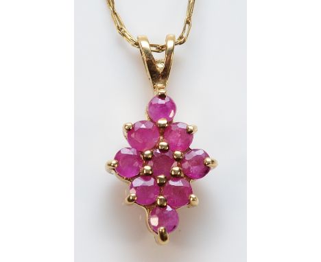 A 9ct gold ruby cluster pendant with a chain, 10mm, 1.7g