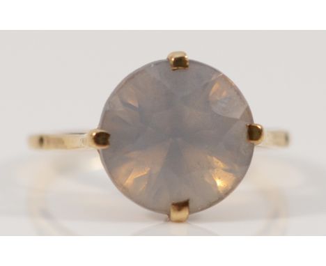 A 9ct gold pale blue gemstone solitaire ring, hallmarks worn, 12mm gemstone, P, 2.7g