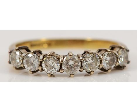 An 18ct gold brilliant cut diamond seven stone ring, R, 3.4g