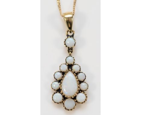 A 9ct gold opal cluster pendant with a chain, 23mm, 2.4g