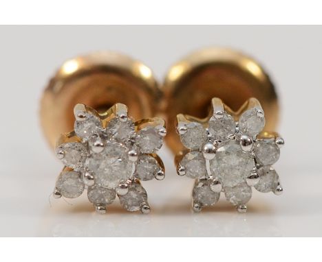 A pair of 9ct gold diamond cluster earrings with scroll backs, 1g