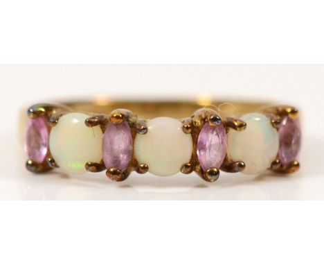 A 9ct gold pink sapphire and opal seven stone ring, L 1/2, 1.8g