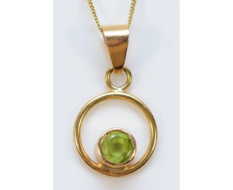 A 9ct gold peridot circle pendant on a chain, 4mm peridot, 1.5g