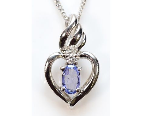 A 9ct white gold tanzanite and diamond heart shaped pendant on a chain, 15mm, 2.2g