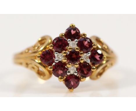 A 9ct gold garnet and diamond cluster ring, Q, 3.5g