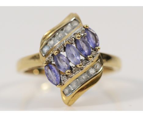 A 9ct gold tanzanite, diamond and blue gemstone dress ring, P 1/2, 2.6g