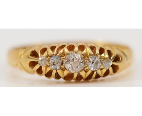 An 18ct gold brilliant cut diamond five stone ring with carved claw detail, Birmingham 1903, P, 2.8g
