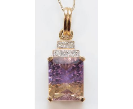 A 10K gold ametrine and diamond pendant on a chain, 11mm x 9mm ametrine, 2.8g