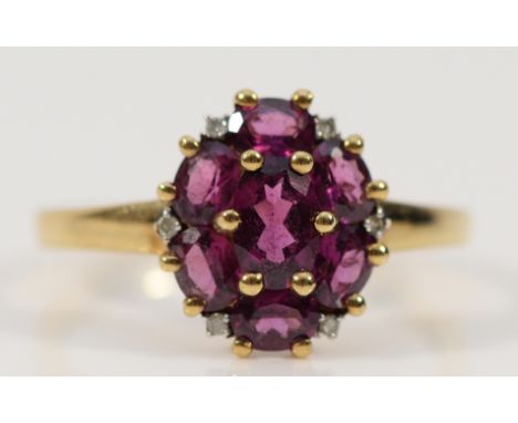 A 9ct gold garnet and diamond cluster ring, Q, 2.5g