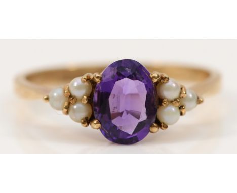 A 9ct gold amethyst and seed pearl dress ring, 8mm x 6mm amethyst, London 1988, P, 2.2g
