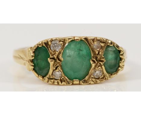 A 9ct gold emerald and diamond dress ring with carved claw detail, M, 2.5g