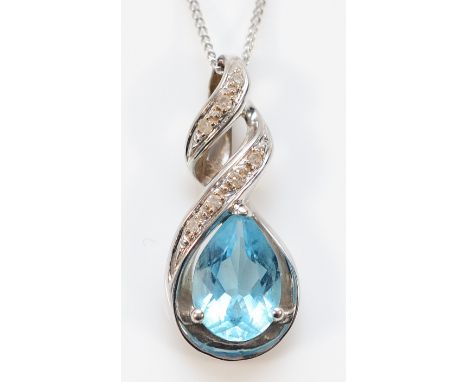 A 9ct white gold blue topaz and diamond pendant with chain, 8mm x 6mm topaz, 2.5g
