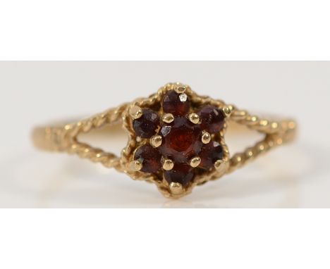 A 9ct gold garnet floral cluster ring, Birmingham 1980, N, 1.2g