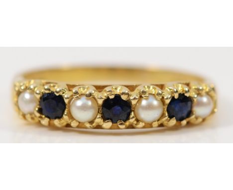 A 9ct gold sapphire and cultured pearl half eternity ring, London 1975, R, 2.4g
