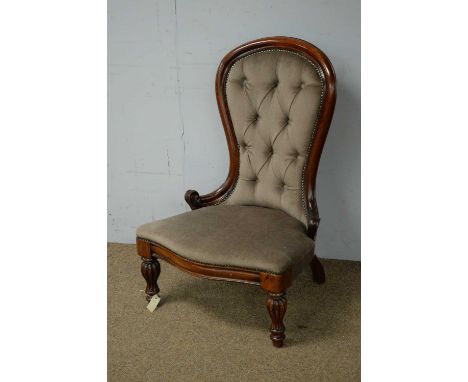 A Victorian mahogany nursing chair, the deep button back, enclosed in a mahogany frame, raised on a padded seat, raised on re