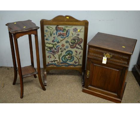 An Edwardian mahogany bedside cabinet, the rectangular top above a single frieze drawer and fielded panelled door below enclo