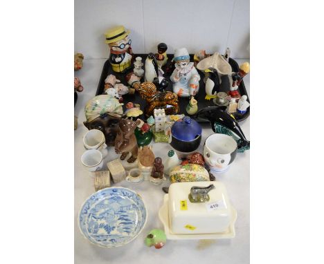 A quantity of decorative collectors' ceramics, including: a Poole penguin; novelty jars and covers; a small quantity of novel