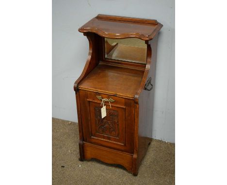 A Victorian walnut coal purdonium, the shaped three-quarter gallery with mirror back, above an acanthus carved fall-front doo