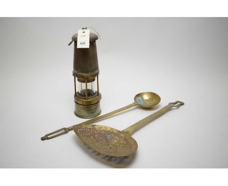 A William Maurice Limited, Sheffield, miner's safety lamp; a brass skillet; and a brass ladle.