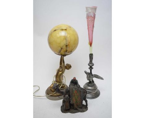 An Art Deco style globe lamp with marbled glass shade, gilt nude female on onyx base; a Spelter cold-painted camel group in t