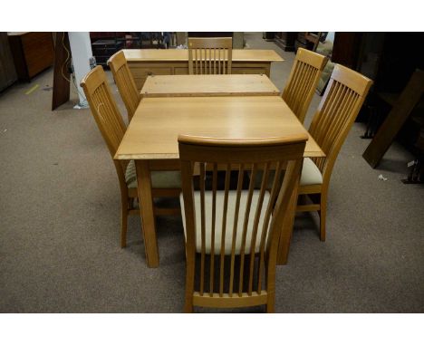 A 20th Century light oak dining room suite, comprising: an extending dining table, the rectangular top with moulded edge and 