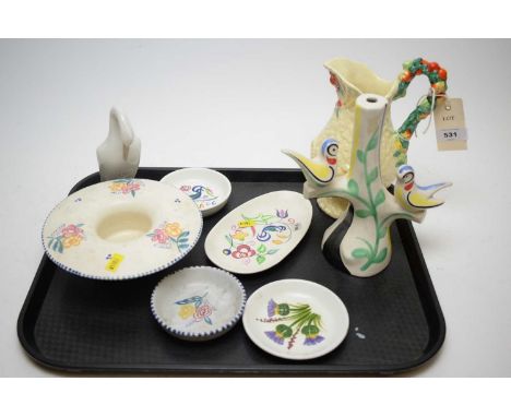 A Clarice Cliff 'Wheatsheaf' pattern jug with floral handle; a small quantity of Poole pottery; a Fantasque Clarice Cliff can