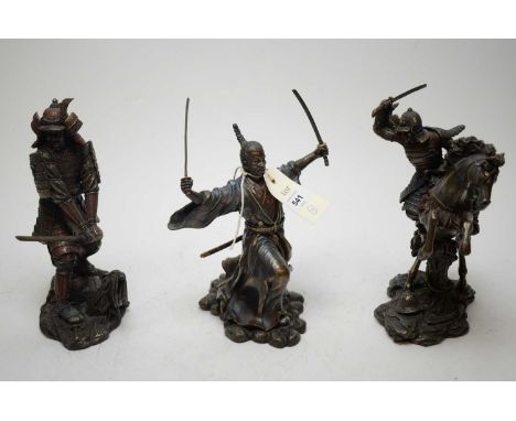 A modern bronze resin figure of a Samurai Warrior depicted lunging forwarding two Samurai swords, 23cms; another depicting a 