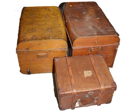 Two vintage metal trunks; and another vintage trunk with wood bindings. (3)
