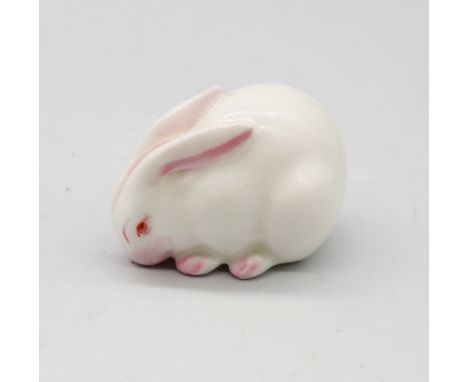 A Royal Worcester netsuke modelled as a white Rabbit, circa 1913, with green stamp underneath, approx. 3.5cm high x 4.9cm lon