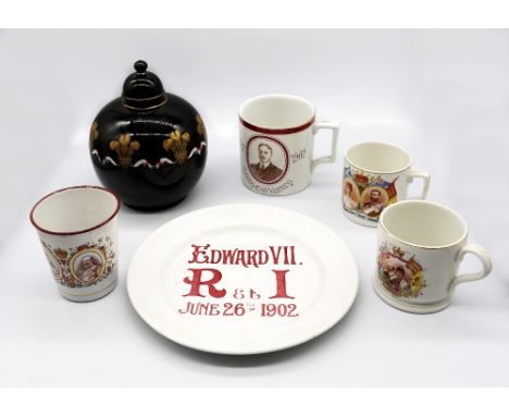 A collection of commemorative pottery items to include; a Prince of Wales tea caddy and cover, with black glazed body, Prince