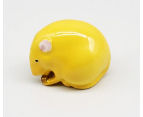 A Royal Worcester netsuke modelled as a mouse with nut in hands, yellow colourway, early to mid 20th century, pink printed ma