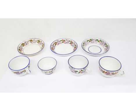 Small collection of Staffordshire pearlware cups and saucers and a tea bowl, decorated with bands of stylised flowers and blu
