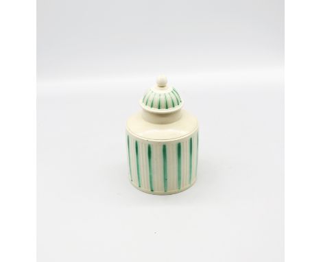 A Leeds creamware tea caddy and cover, with a ribbed body decorated  with green stripes  Circa 1775.  Size 14.5cm  Condition.