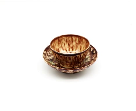 A Staffordshire. Whieldon style tea bowl and saucer, decorated in green and brown glazes Circa 1775. Size. TB 8cm diameter 5c