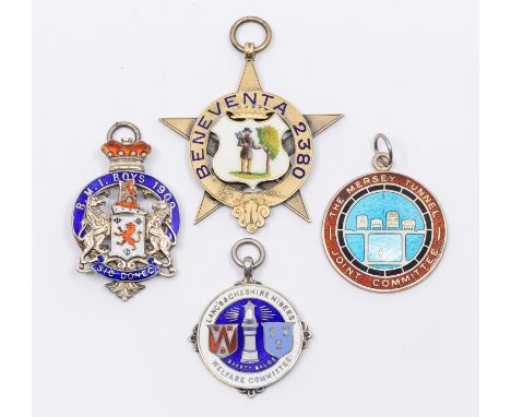 A collection of fob medals to include: a Victorian silver gilt star shaped fob medal, central shield shaped enamelled tree cu