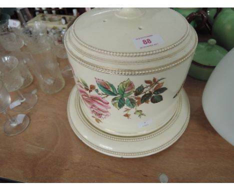 A large ceramic cheese dome