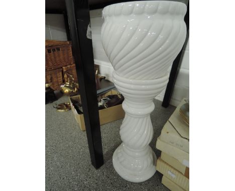 A ceramic planter and stand with swirl design