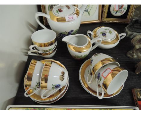 A part tea service with fruit and gilt decoration 