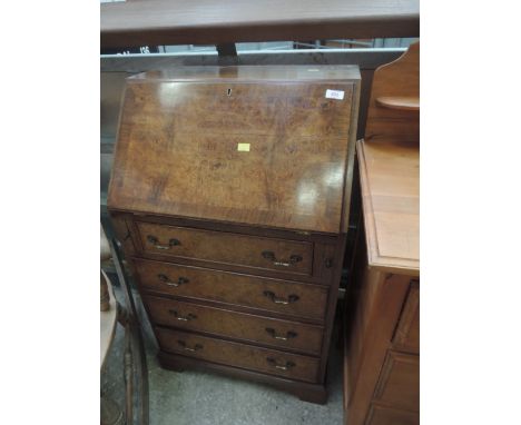 A vintage walnut bureau