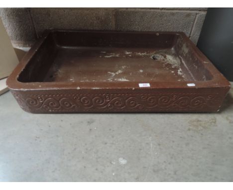 A glazed stoneware shallow trough