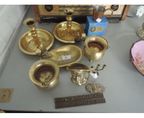 A selection of vintage brass ware including small caldron, candle stick and snuffer, bath tub ash tray etc