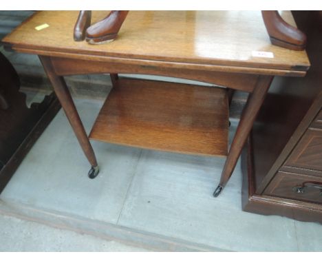 A vintage mahogany fold over tea trolley
