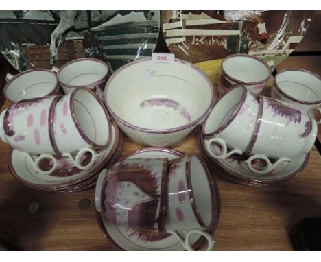 A part tea service un named purple and pink decoration