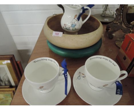 Two childrens cups and saucers and milk from Whitards, a ceramic bowl and turned wooden bowl