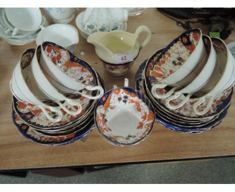 A selection of vintage ceramic Imari ware style plates and saucers 25 pieces approx
